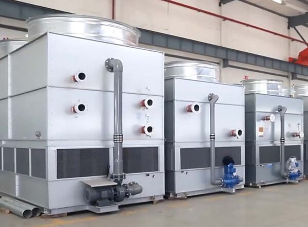 45 degree view of three finished counter flow closed circuit cooling towers / fluid coolers