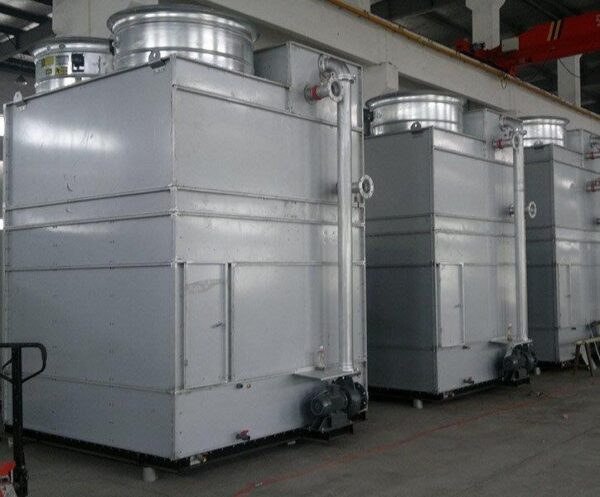 45 degree view of three finished combined flow closed circuit cooling towers / fluid coolers